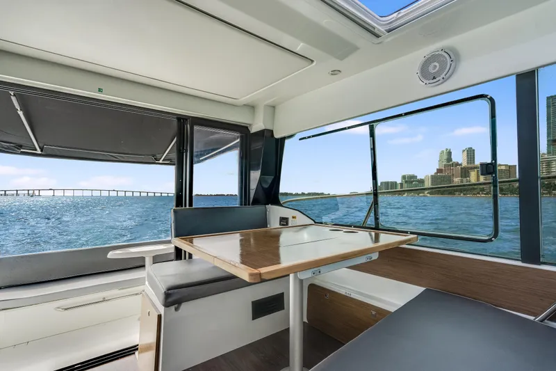 Slide: The Image of Interior of 2019 Jeanneau NC 1095 boat with city skyline view. - 21