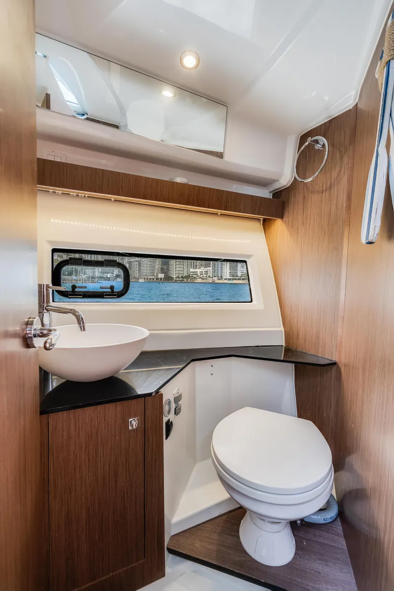 Slide: The Image of 2019 Jeanneau NC 1095 boat bathroom with modern fixtures and window view. - 24