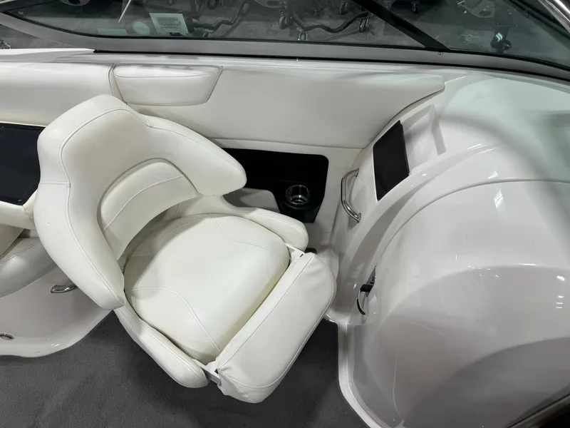 Slide: The Image of 2011 Regal 2500 LSR boat interior with white leather seating. - 13