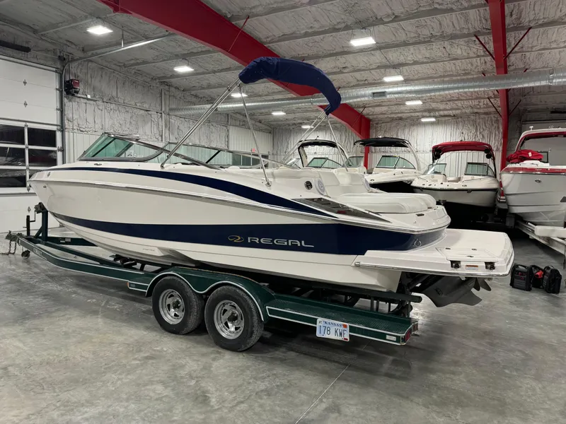 Slide: The Image of 2011 Regal 2500 LSR boat on trailer in indoor storage facility. - 3