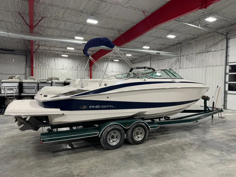 Slide: The Image of 2011 Regal 2500 LSR boat on trailer in indoor storage facility. - 4
