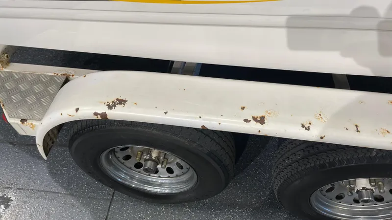 Slide: The Image of 2005 Chaparral 210 SSi trailer with rusted fender and dual wheels. - 10