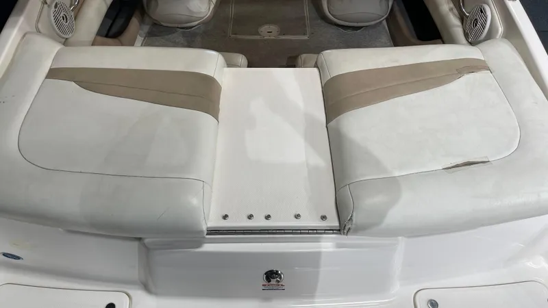 Slide: The Image of 2005 Chaparral 210 SSi boat interior with cushioned seating and speaker system. - 15