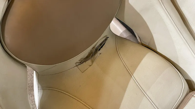 Slide: The Image of Damaged seat upholstery in 2005 Chaparral 210 SSi boat. - 19