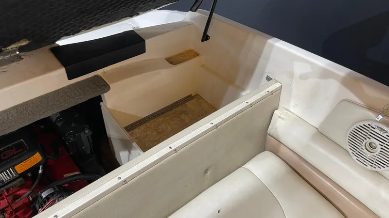 Slide: The Image of 2005 Chaparral 210 SSi boat interior with engine compartment and seating area. - 23