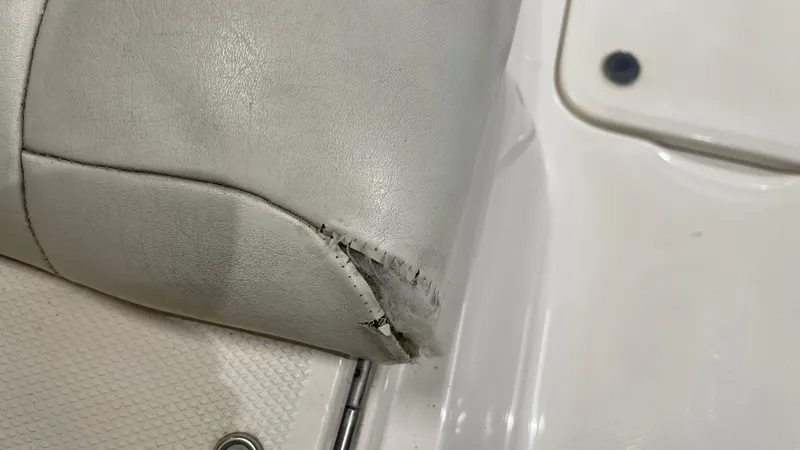 Slide: The Image of Torn upholstery on 2005 Chaparral 210 SSi boat seat. - 25