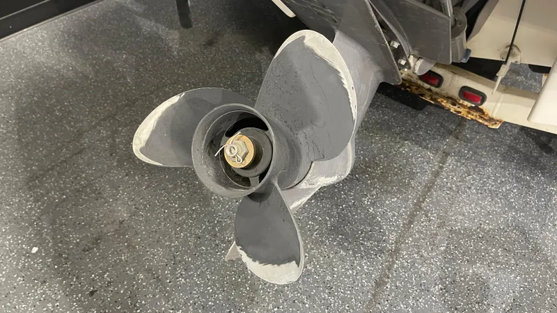 Slide: The Image of Close-up of a 2005 Chaparral 210 SSi boat propeller on a textured floor. - 5