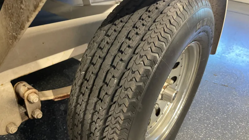 Slide: The Image of Close-up of a 2005 Chaparral 210 SSi trailer tire on a metal rim. - 8