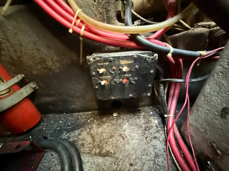 Slide: The Image of Electrical panel with red wires in 1984 Sea Ray 390 Express Cruiser engine room. - 29