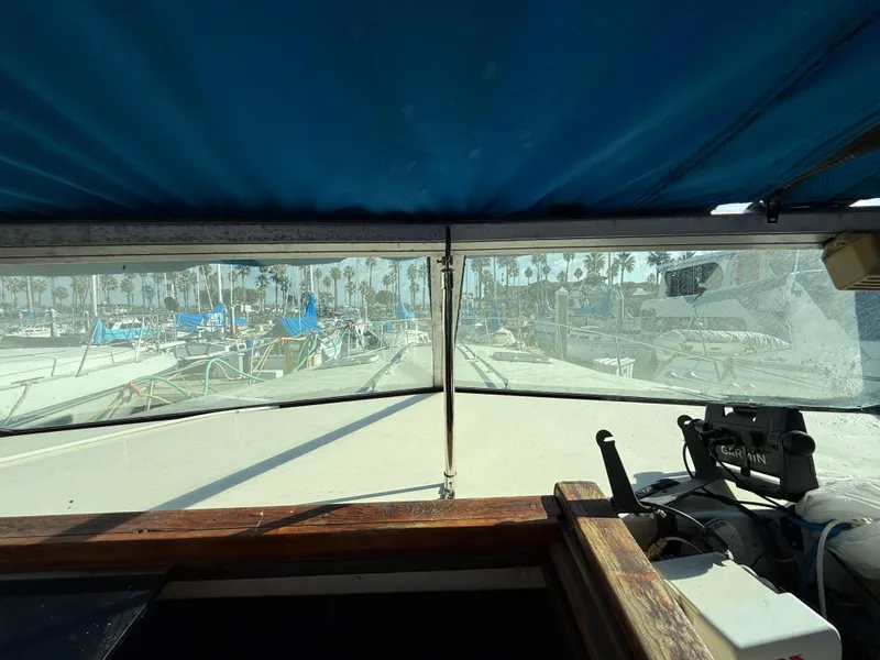 Slide: The Image of View from 1984 Sea Ray 390 Express Cruiser cockpit, marina in background. - 7