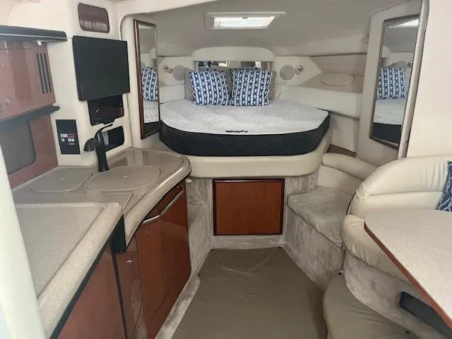 Slide: The Image of Interior of 2000 Sea Ray 340 Sundancer yacht with cozy cabin and modern amenities. - 12