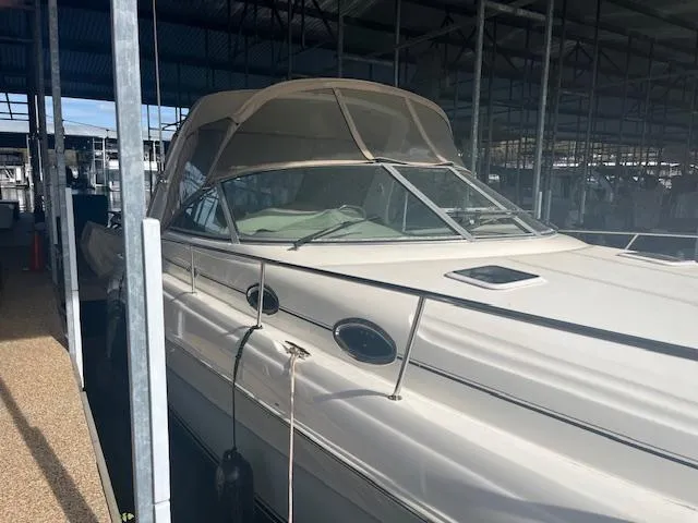 Slide: The Image of 2000 Sea Ray 340 Sundancer docked in a covered marina. - 2