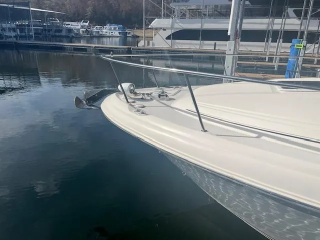 Slide: The Image of 2000 Sea Ray 340 Sundancer docked at marina, calm water reflection. - 4
