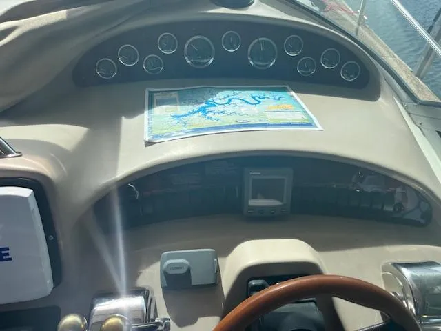 Slide: The Image of Dashboard of 2000 Sea Ray 340 Sundancer with navigation map and gauges. - 6