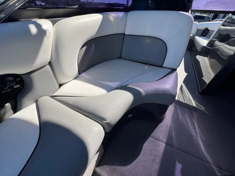 Slide: The Image of 2007 Supra 24SSV boat interior with gray and white seating. - 10