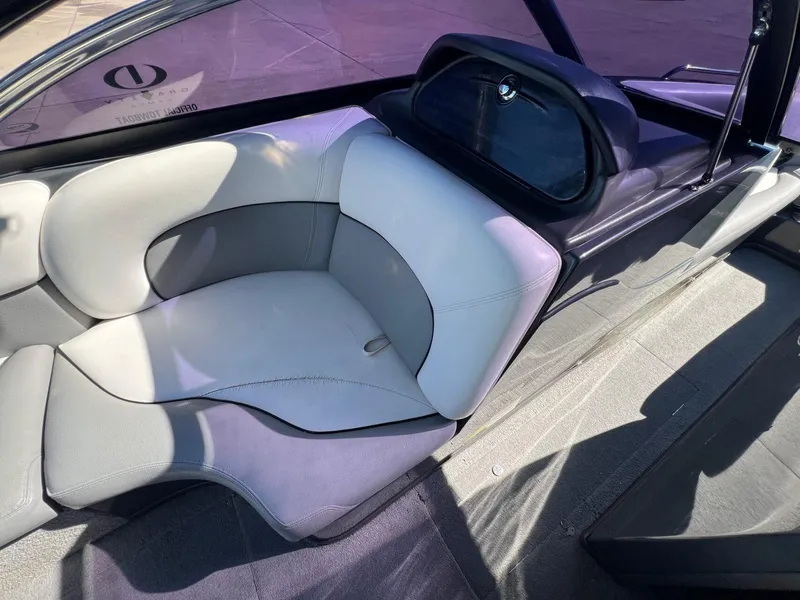 Slide: The Image of 2007 Supra 24SSV boat interior with gray and white seating, showcasing modern design. - 14