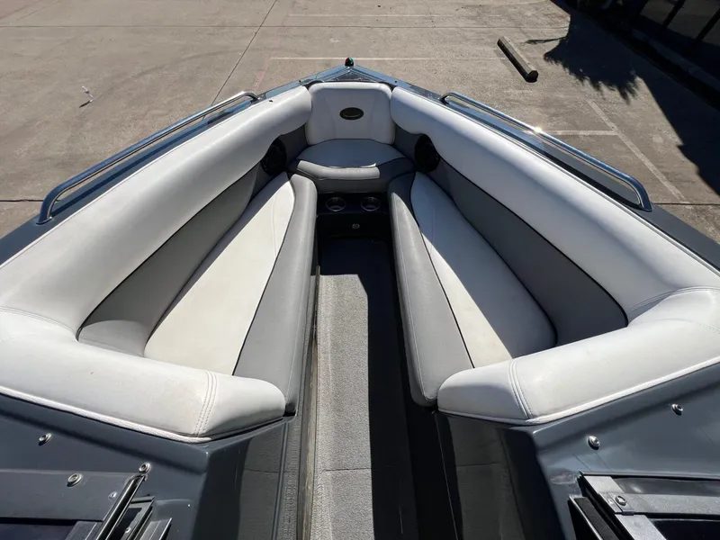 Slide: The Image of 2007 Supra 24SSV boat interior with white cushioned seating and stainless steel railings. - 18