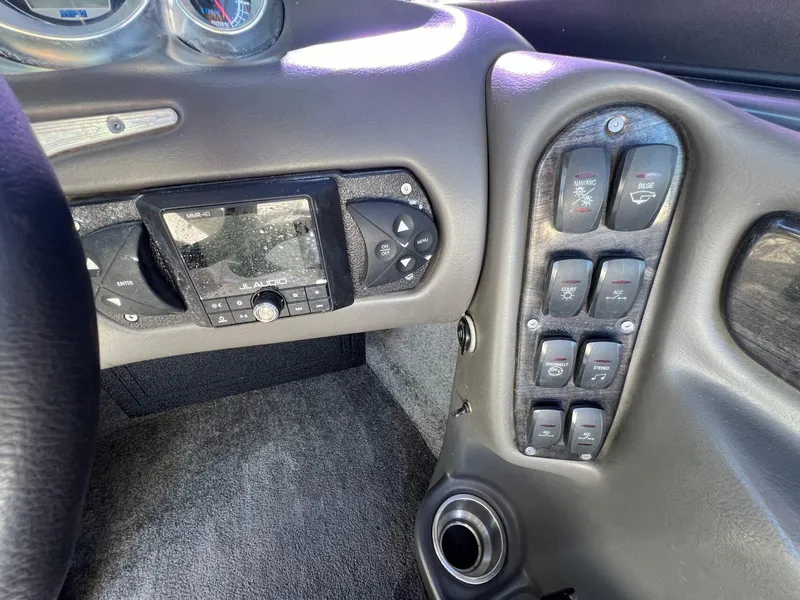 Slide: The Image of 2007 Supra 24SSV dashboard with JL Audio system and control panel. - 21