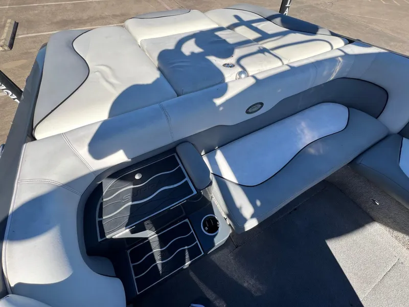 Slide: The Image of 2007 Supra 24SSV boat interior with gray seating and flooring. - 7