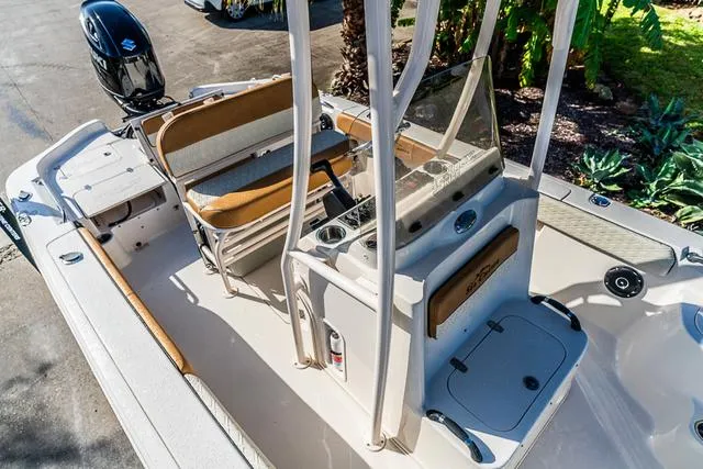 Slide: The Image of 2025 Carolina Skiff 23LX boat interior with seating and console, featuring modern design elements. - 14