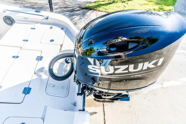 Slide: The Image of 2025 Carolina Skiff 23LX with Suzuki outboard motor, top view. - 16