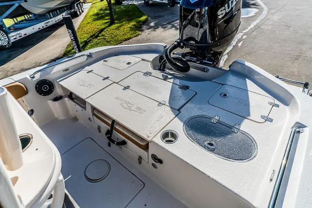 Slide: The Image of 2025 Carolina Skiff 23LX boat deck with Suzuki outboard motor. - 5