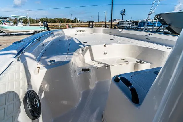 Slide: The Image of 2025 Carolina Skiff 23LX boat interior with spacious seating and modern design. - 9