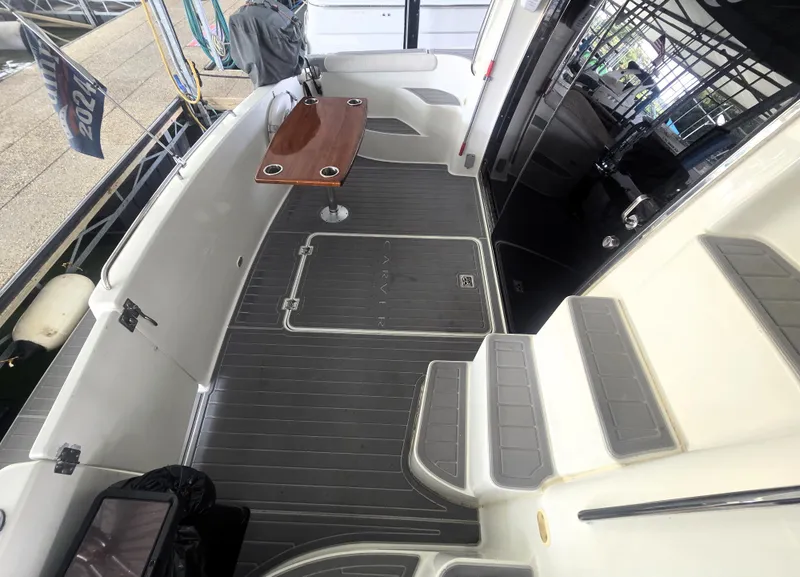 Slide: The Image of 2004 Carver 460 Voyager yacht deck with seating and table. - 11