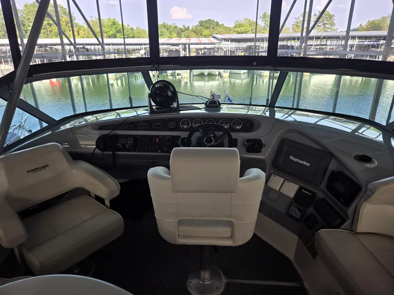 Slide: The Image of Interior view of 2004 Carver 460 Voyager yacht cockpit with steering and navigation equipment. - 14