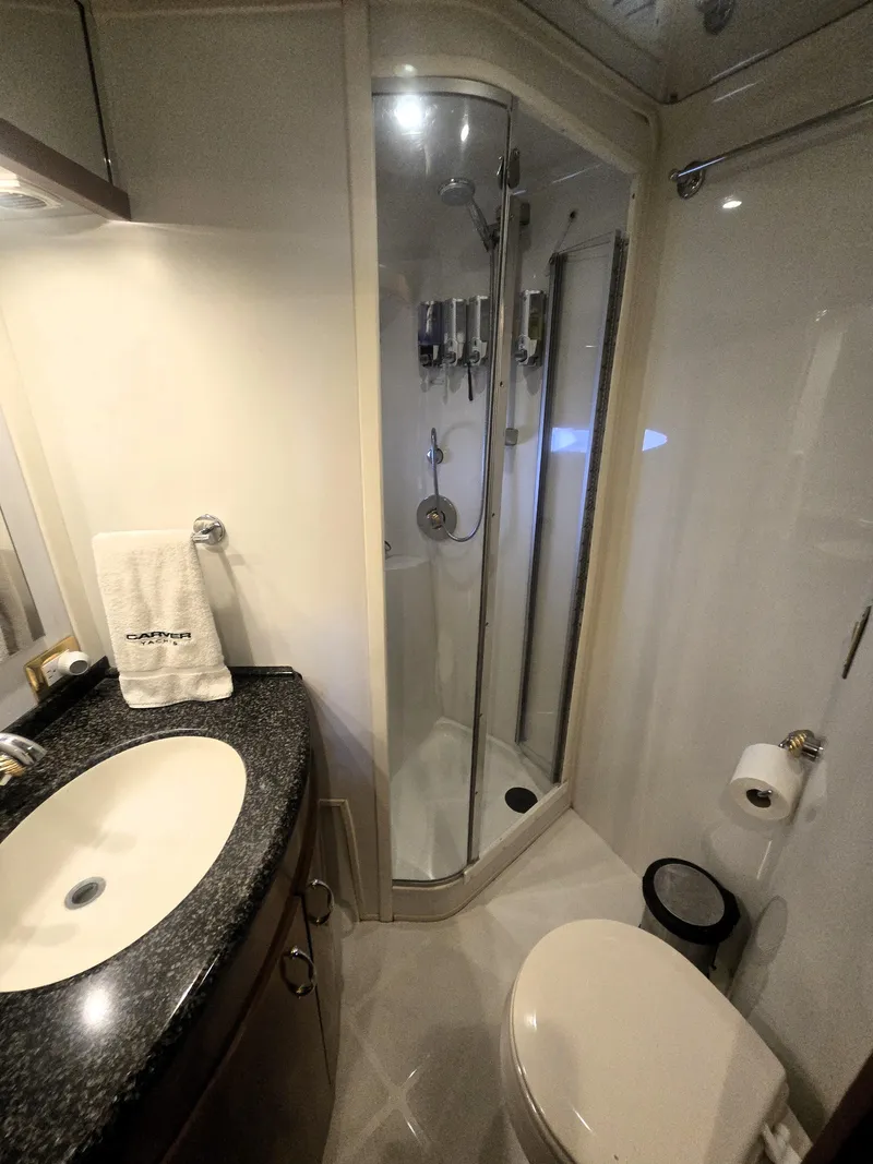 Slide: The Image of Luxurious bathroom in 2004 Carver 460 Voyager yacht with shower and modern amenities. - 18