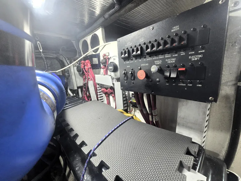 Slide: The Image of Engine room of 2004 Carver 460 Voyager with control panel and wiring. - 23