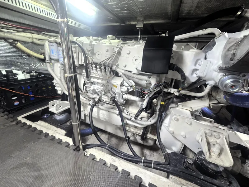 Slide: The Image of Engine room of 2004 Carver 460 Voyager yacht, showcasing detailed mechanical components. - 26