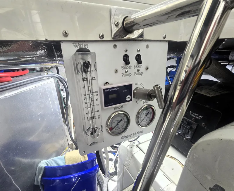 Slide: The Image of Control panel of a 2004 Carver 460 Voyager boat with gauges and switches. - 27