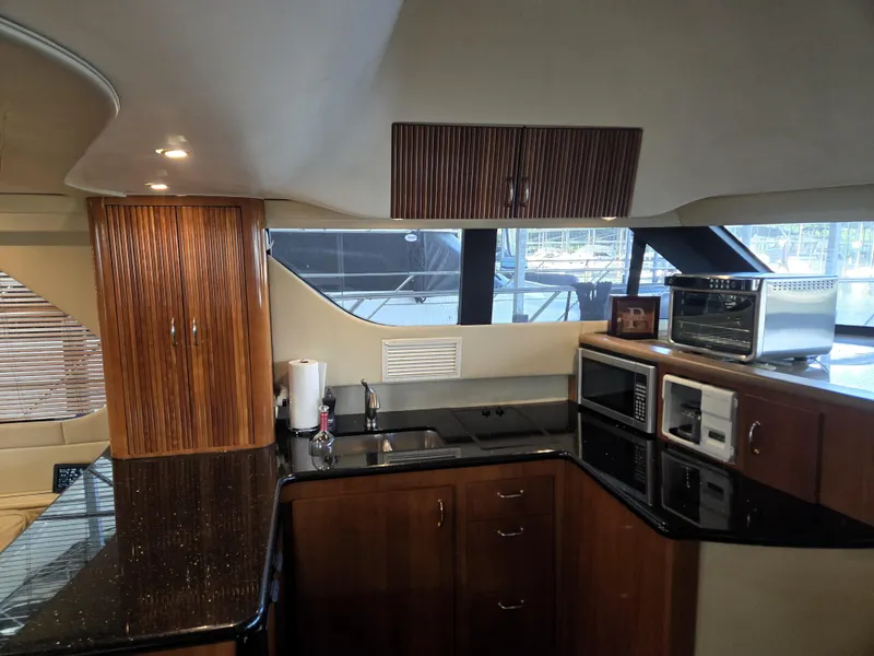 Slide: The Image of Luxurious kitchen interior of 2004 Carver 460 Voyager yacht with modern appliances. - 9