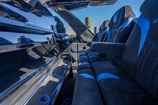 Slide: The Image of 2025 Statement 44 GTrs interior with sleek black and blue seating design. - 16