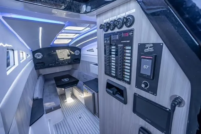 Slide: The Image of 2025 Statement 44 GTrs boat interior with modern control panel and ambient lighting. - 20