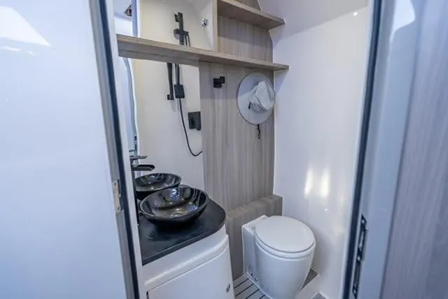 Slide: The Image of Modern bathroom in 2025 Statement 44 GTrs boat with dual sinks and compact toilet. - 21