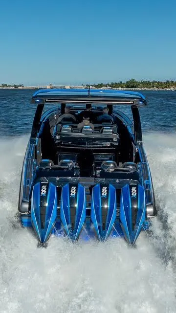 Slide: The Image of 2025 Statement 44 GTrs speedboat with powerful engines cruising on open water. - 23