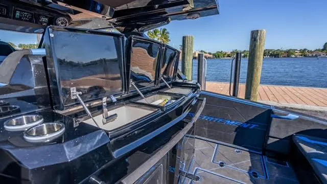 Slide: The Image of Luxury interior of 2025 Statement 44 GTrs boat docked by the water. - 27