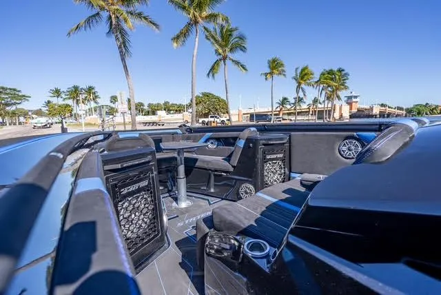 Slide: The Image of Luxurious 2025 Statement 44 GTrs boat interior with palm trees in the background. - 29