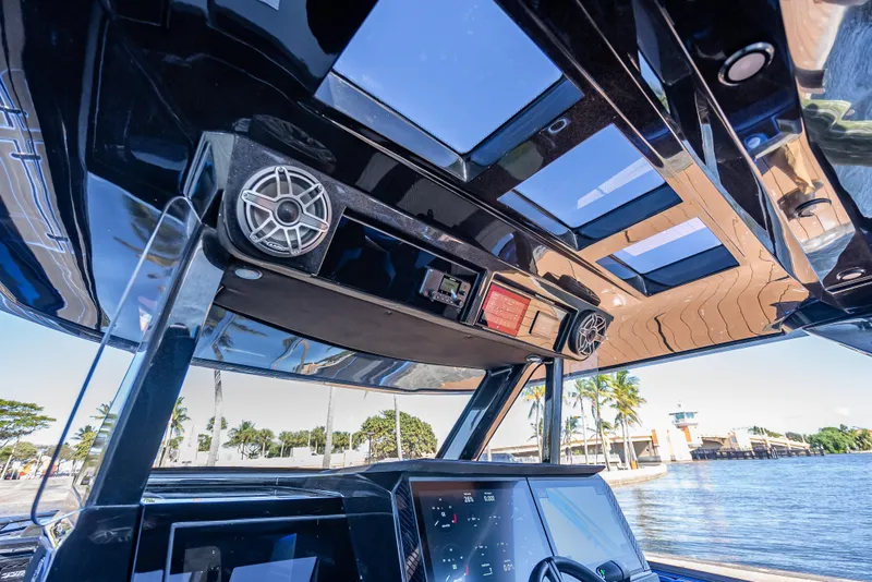 Slide: The Image of Interior view of 2025 Statement 44 GTrs boat with modern dashboard and speakers. - 34