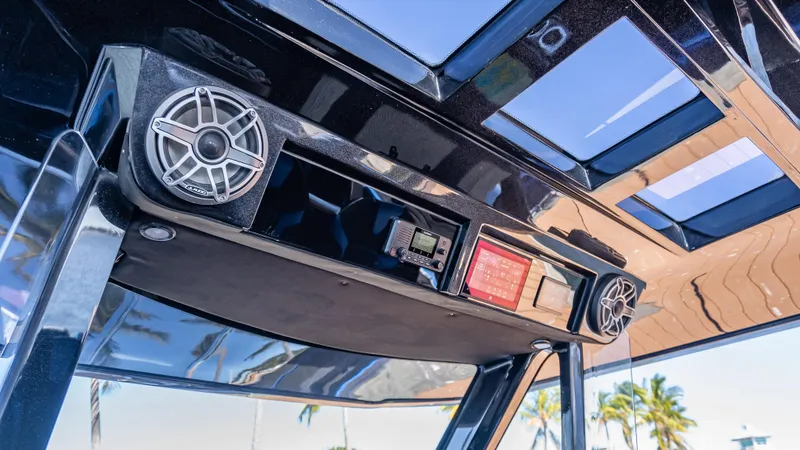 Slide: The Image of 2025 Statement 44 GTrs boat interior with speakers and control panel. - 38