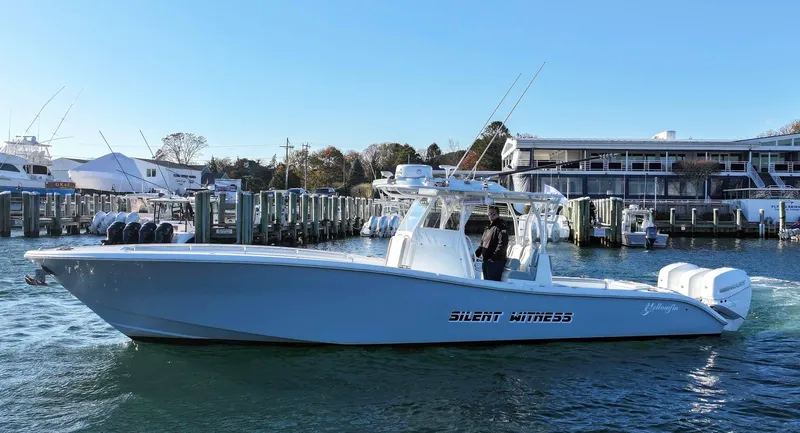 Slide: The Image of 2021 Yellowfin 36 Offshore boat docked at marina, side view. - 0