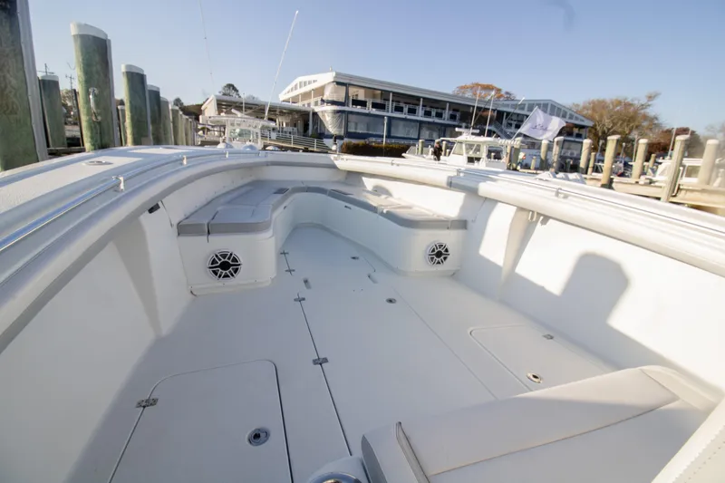 Slide: The Image of 2021 Yellowfin 36 Offshore boat interior at marina, showcasing spacious seating and modern design. - 3