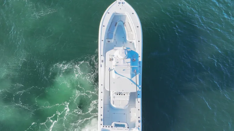 Slide: The Image of Aerial view of 2021 Yellowfin 36 Offshore boat cruising on open water. - 7