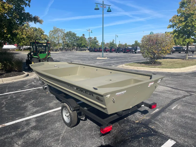 Slide: The Image of 2025 Tracker Grizzly 1648 Jon boat on trailer in parking lot. - 3