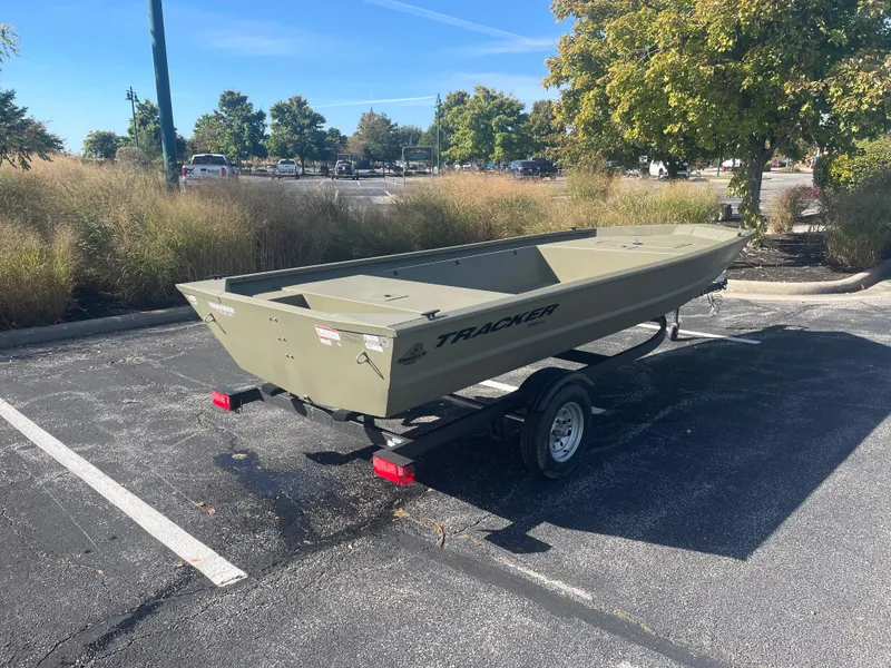 Slide: The Image of 2025 Tracker Grizzly 1648 Jon boat on trailer in parking lot. - 4