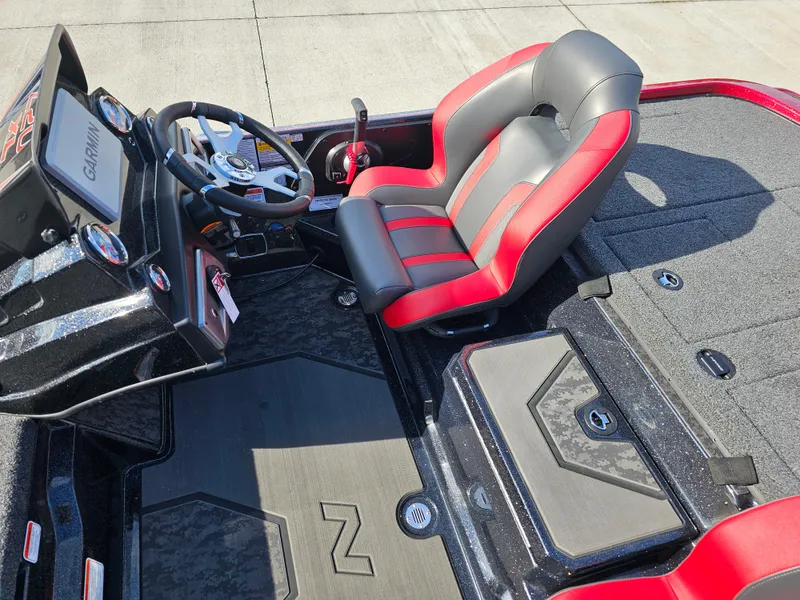 Slide: The Image of 2025 Nitro Z20 XL Pro boat interior with red and black seating and Garmin dashboard. - 15