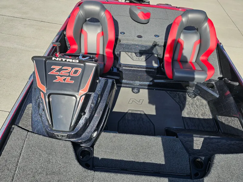 Slide: The Image of 2025 Nitro Z20 XL Pro boat interior with red and gray seats. - 25
