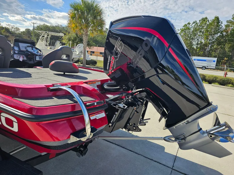 Slide: The Image of 2025 Nitro Z20 XL Pro boat with powerful outboard motor, parked outdoors. - 9